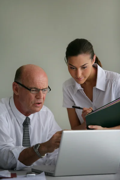 Bald businessman with his young assistant — Stock Photo, Image