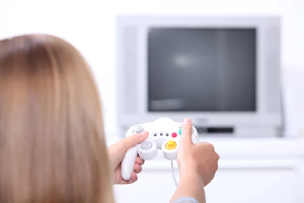 Mulher jogando jogos de vídeo — Fotografia de Stock