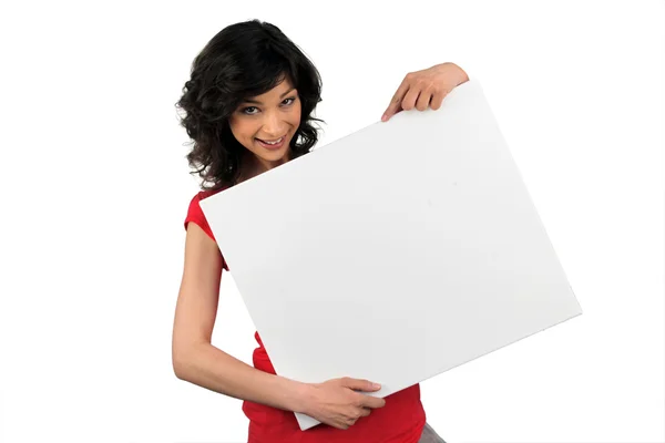 Brunette woman behind the white panel — Stock Photo, Image