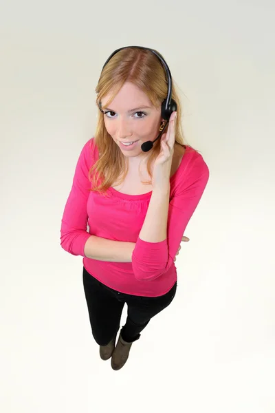 Dívka s sluchátka a mikrofon — Stock fotografie