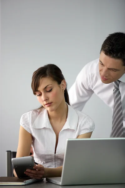 Business couple going over accounts — Stock Photo, Image