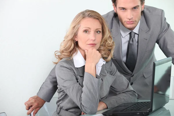 Executives with laptop computer Stock Image