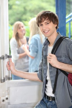 Teenage boy leaving high school clipart