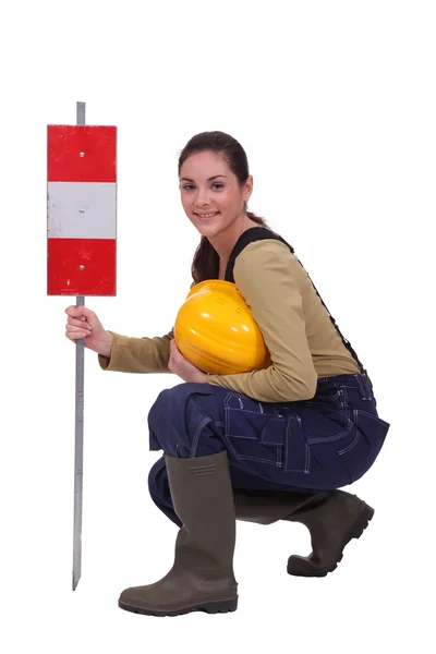 Construction work with a warning sign — Stock Photo, Image