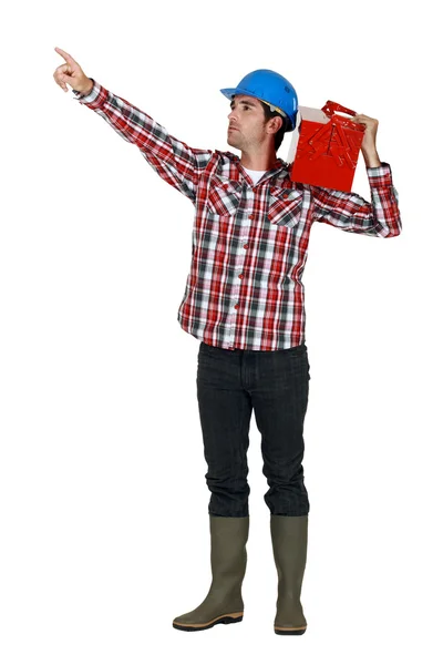 A manual worker pointing at something. — Stock Photo, Image