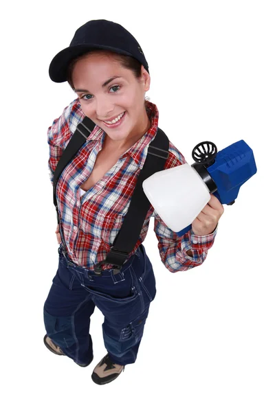 Woman with paint spaying device — Stock Photo, Image