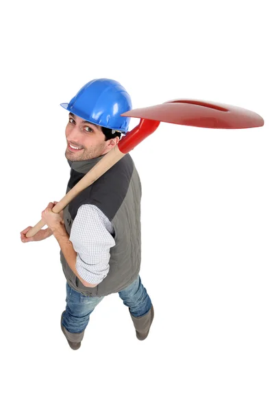 Trabajador llevando pala sobre fondo blanco —  Fotos de Stock
