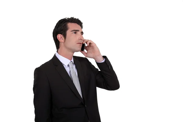 彼の携帯電話で話している実業家 — ストック写真