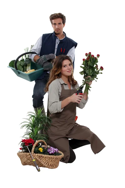 Egy férfi növényi farmer és egy női virágüzlet — Stock Fotó