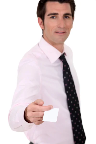 Man holding out his business card — Stockfoto
