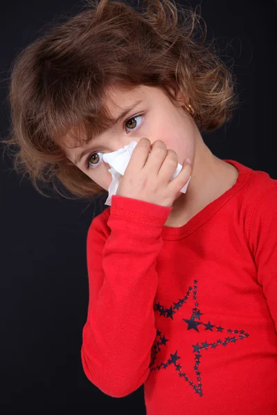 Little girl blowing her nose — Stock Photo, Image