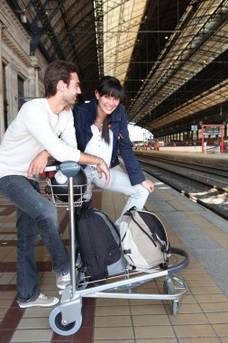 Couple waiting for the train clipart