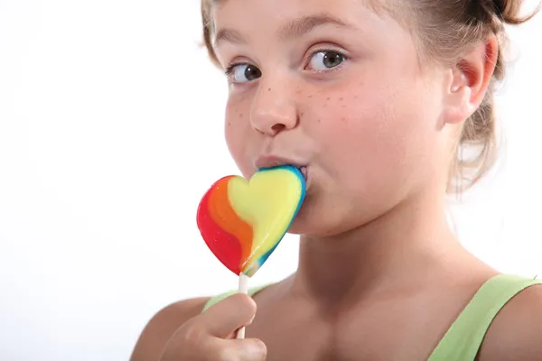 Little girl holding lollipop — Stock Photo, Image
