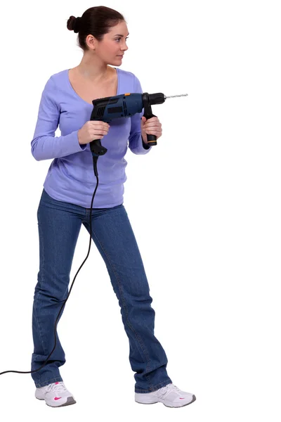 Kvinna hantering drill — Stockfoto