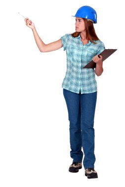 A female foreman with a clipboard. clipart