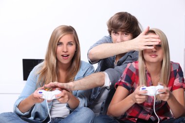 Teenagers playing video games clipart