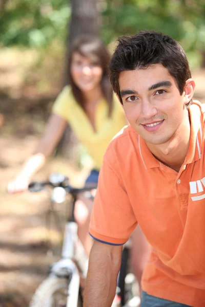 Close-up of a young man on a bike Stock Image