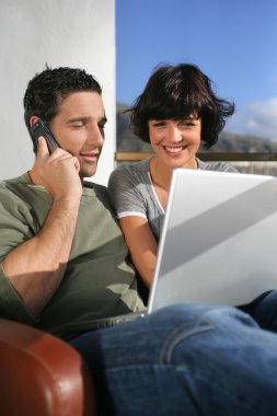 Elated couple learning happy news clipart