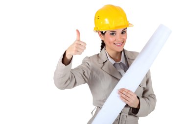 Cheery female architect giving the go-ahead clipart