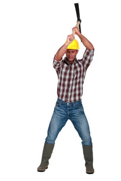 Construction worker with pickaxe — Stock Photo, Image