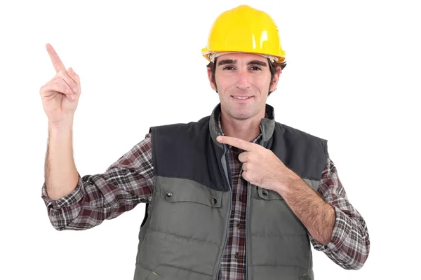 Bauarbeiter zeigt an lizenzfreie Stockbilder