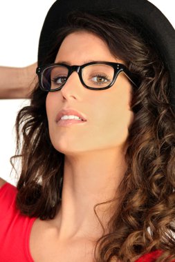 Portrait of woman with sunglasses and a hat clipart