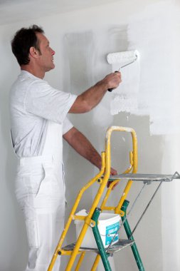 Man painting a wall clipart