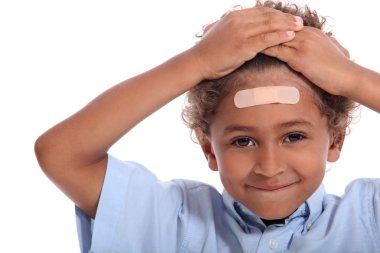 Little boy with plaster on head clipart