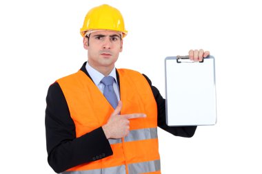 Engineer pointing to a clipboard clipart