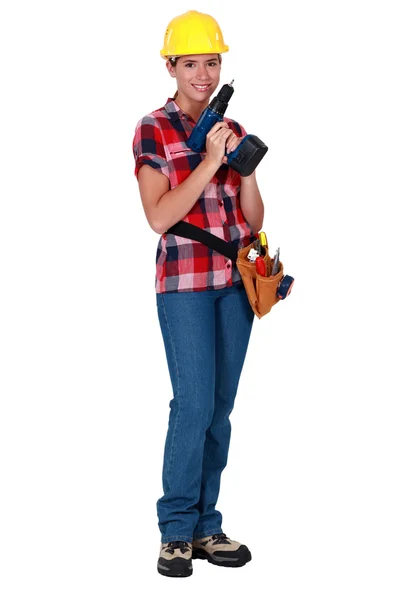 Kvinnlig arbetstagare med en borr — Stockfoto