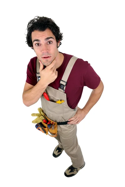 Carpenter with his hand on his chin — Stock Photo, Image