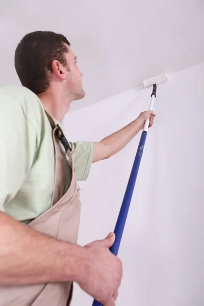 Painter with roller brush — Stock Photo, Image