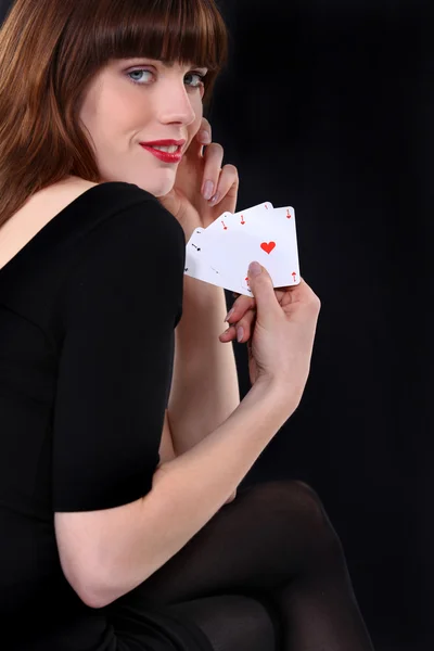 Woman holding four aces — Stock Photo, Image
