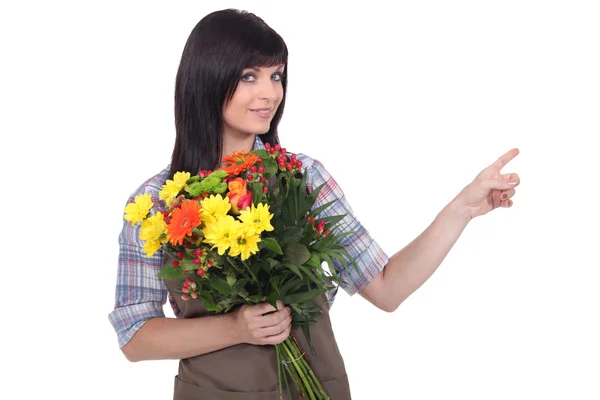 stock image Pretty florist pointing a direction