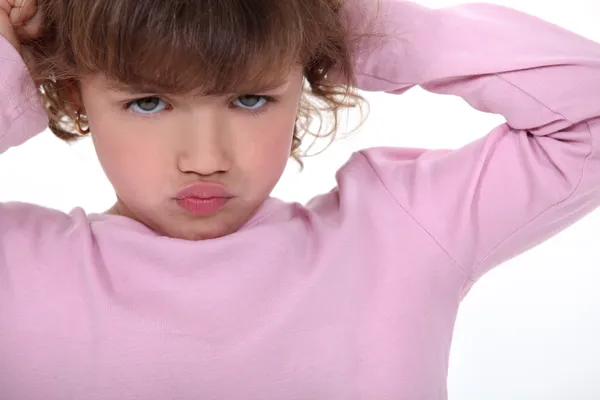 Niña haciendo pucheros —  Fotos de Stock