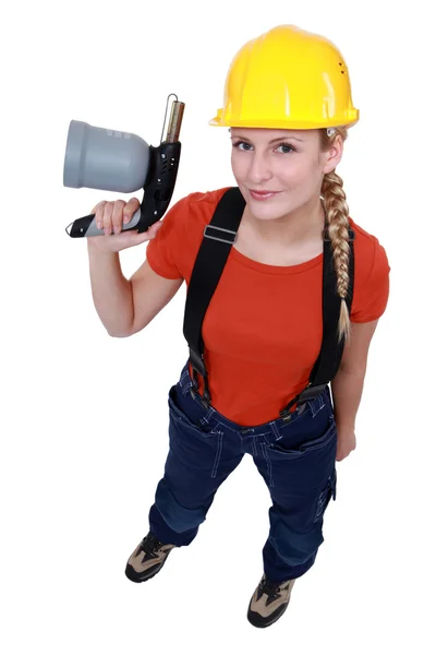 Blond woman holding blow torch — Stock Photo, Image