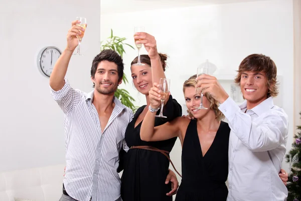 Two young couples drinking champagne — Stock Photo, Image