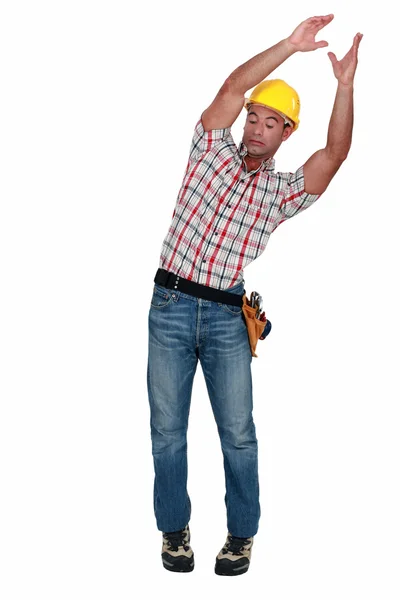 Craftsman carrying something and trying to keep balance — Stock Photo, Image
