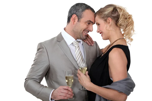 Couple drinking champagne in studio — Stock Photo, Image