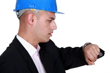 Worried engineer looking at the time clipart