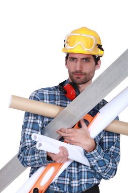 Handyman struggling to carry his equipment clipart