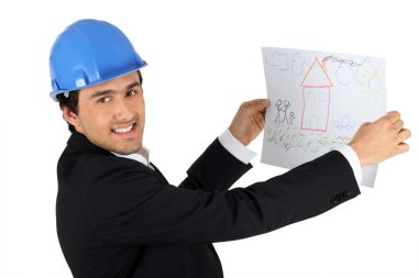 Architect holding kids drawing of a house clipart