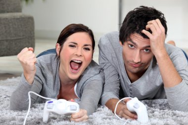 A couple playing video games clipart
