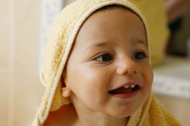 Baby boy taking a bath clipart