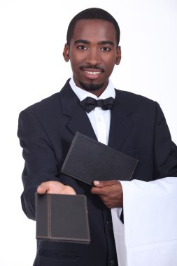 Waiter offering a menu clipart