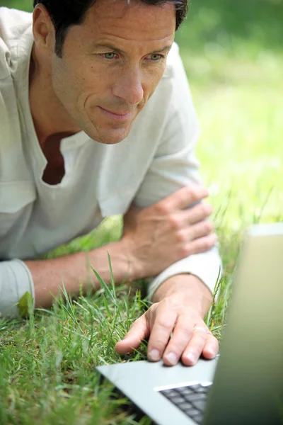 Man working on the grass — Stock Photo, Image
