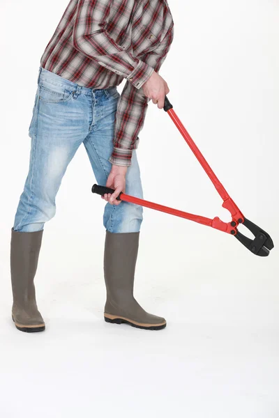 Anonymous worker with a pair of bolt cutters — Stock Photo, Image