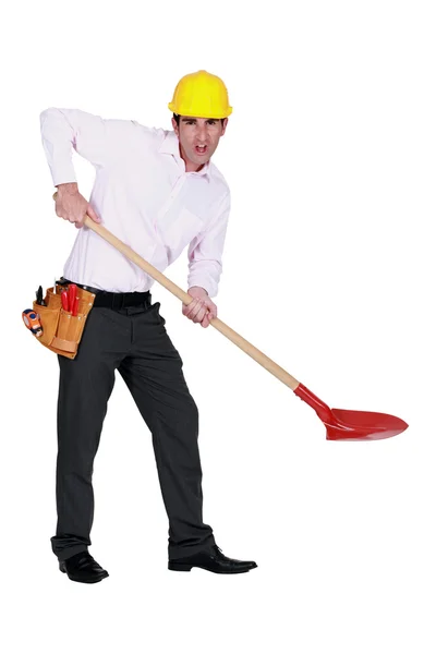 Protesting engineer using a spade — Stock Photo, Image