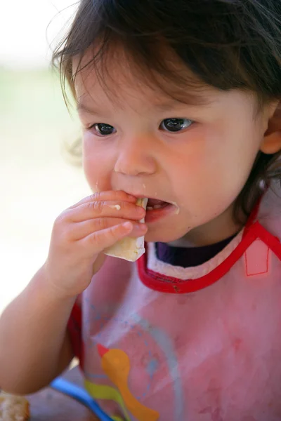 Little girl eating her lunch — Stock Photo, Image