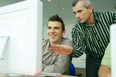 Man teaching computer skills clipart